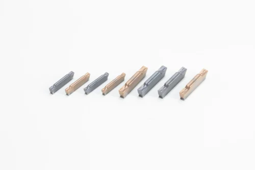 Cutting and grooving inserts
